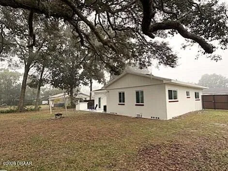 a view of a yard with trees