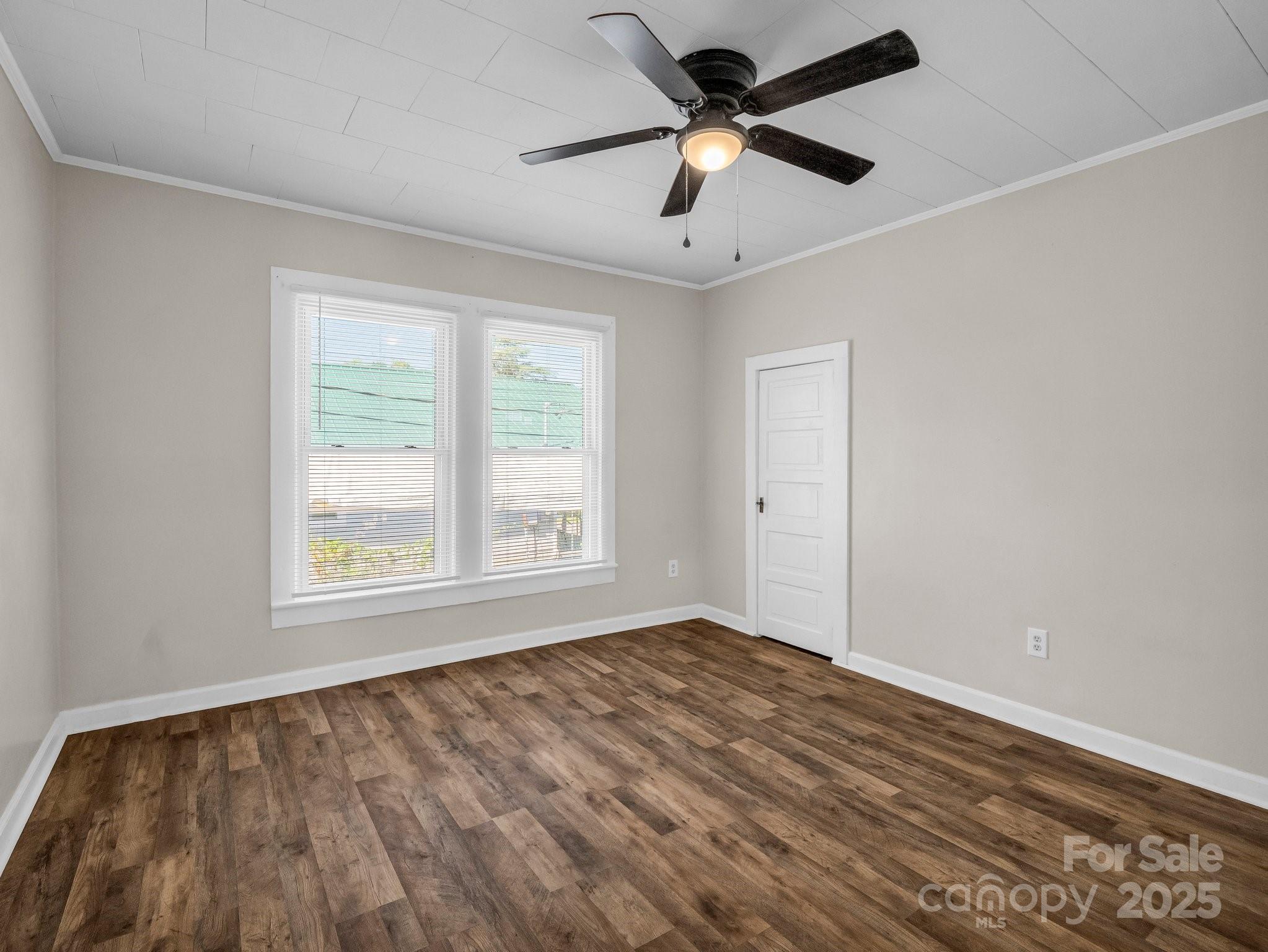 149 Wisconsin Street Spindale, NC 28160 - Photo 13 of 23 wooden floor in an empty room with a window