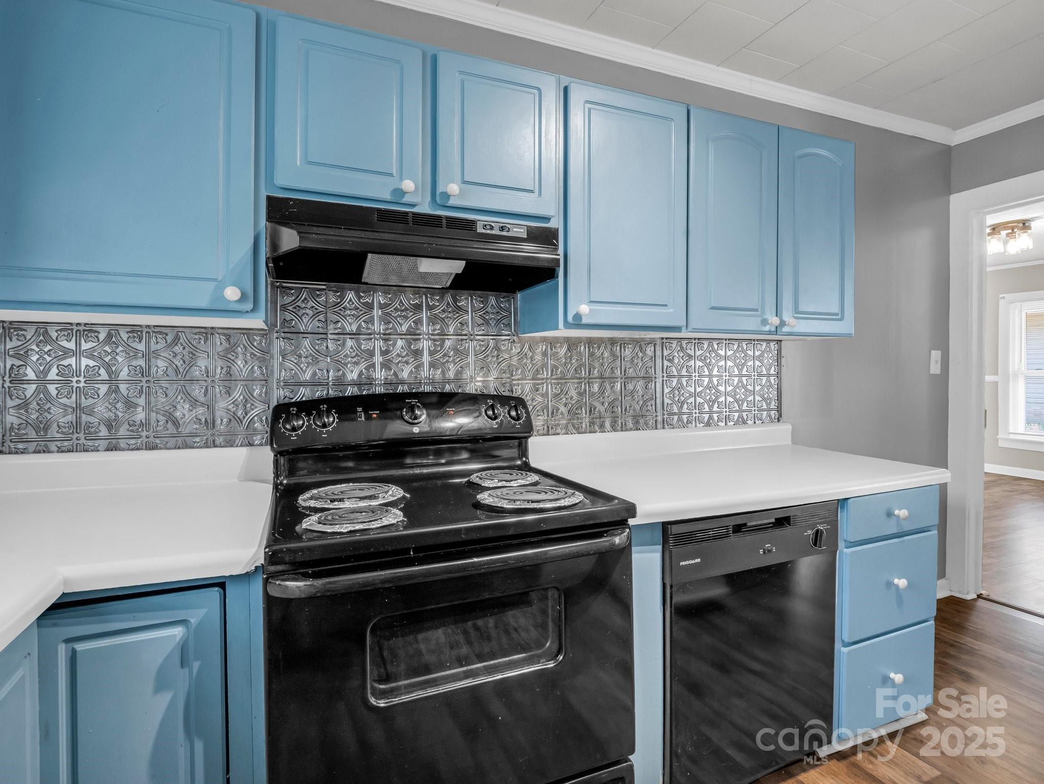 149 Wisconsin Street Spindale, NC 28160 - Photo 17 of 23 a kitchen with wooden cabinets and a stove top oven
