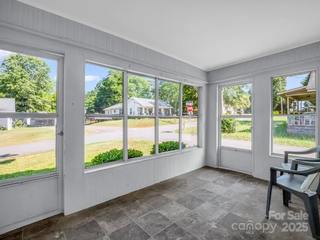 a view of balcony with wooden floor and fence