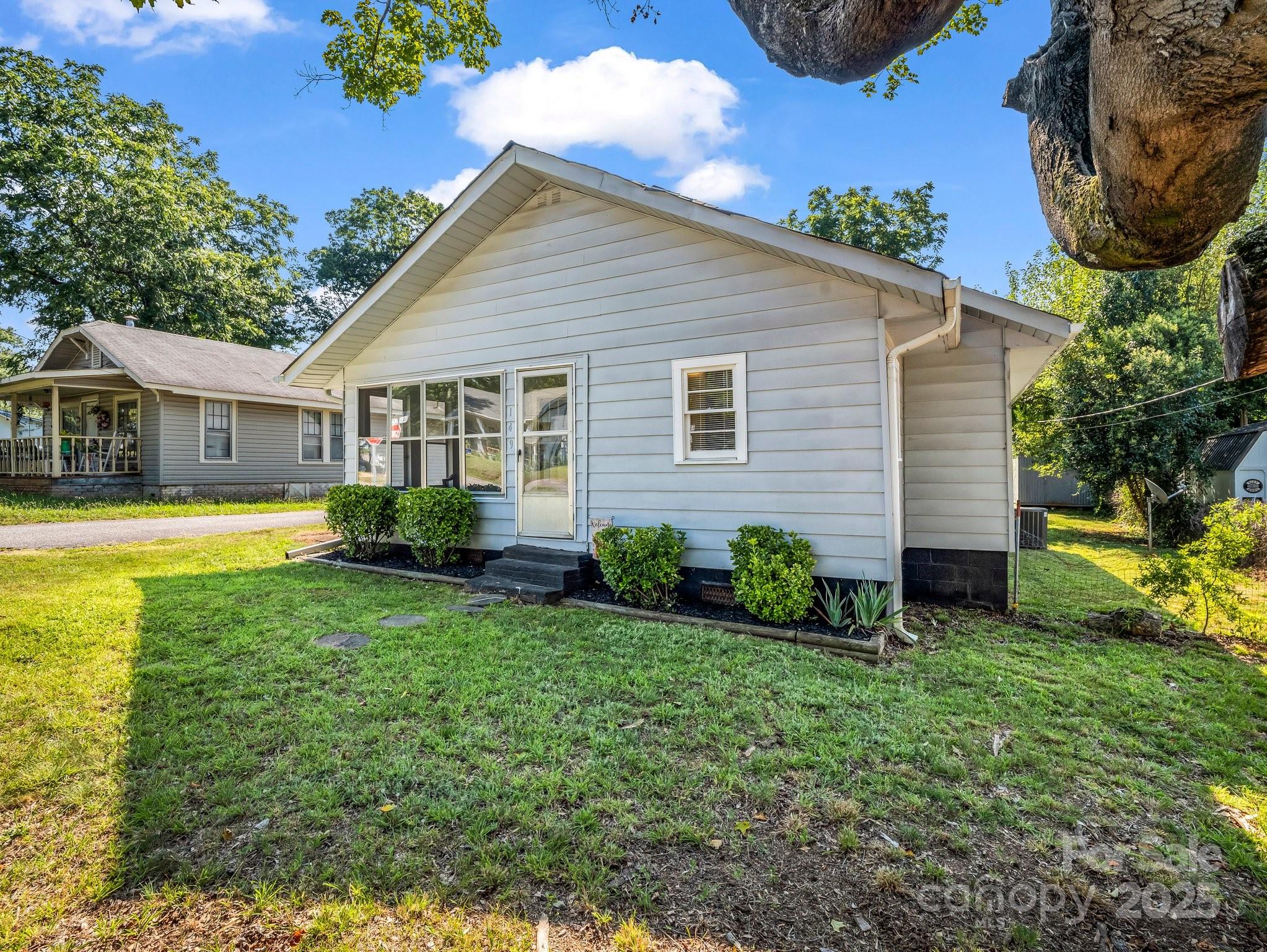 149 Wisconsin Street Spindale, NC 28160 - Photo 2 of 23 a view of house with a yard