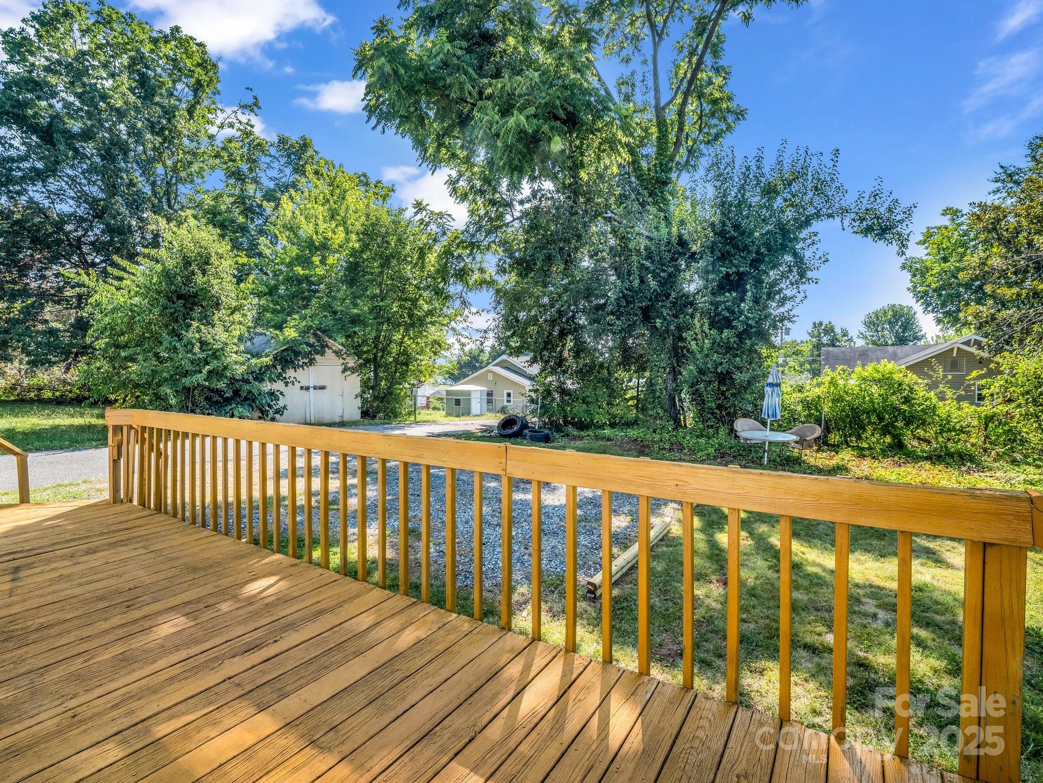 149 Wisconsin Street Spindale, NC 28160 - Photo 22 of 23 a balcony with wooden floor and yard in the back