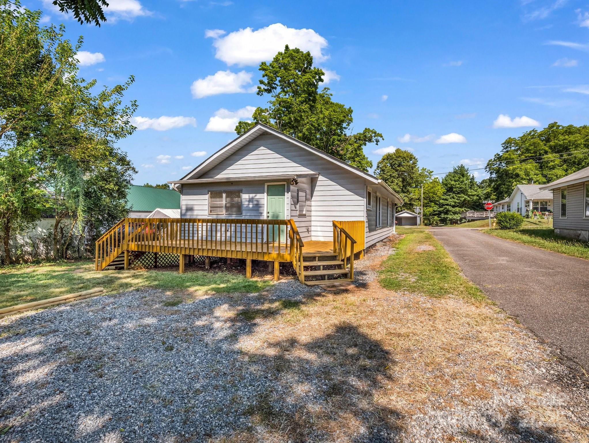 149 Wisconsin Street Spindale, NC 28160 - Photo 3 of 23 a view of a house with a yard