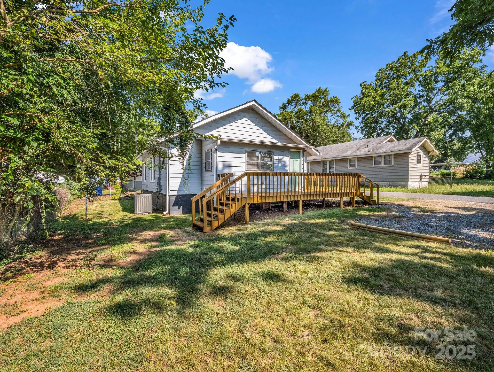 149 Wisconsin Street Spindale, NC 28160 - Photo 4 of 23 a house view with a garden space
