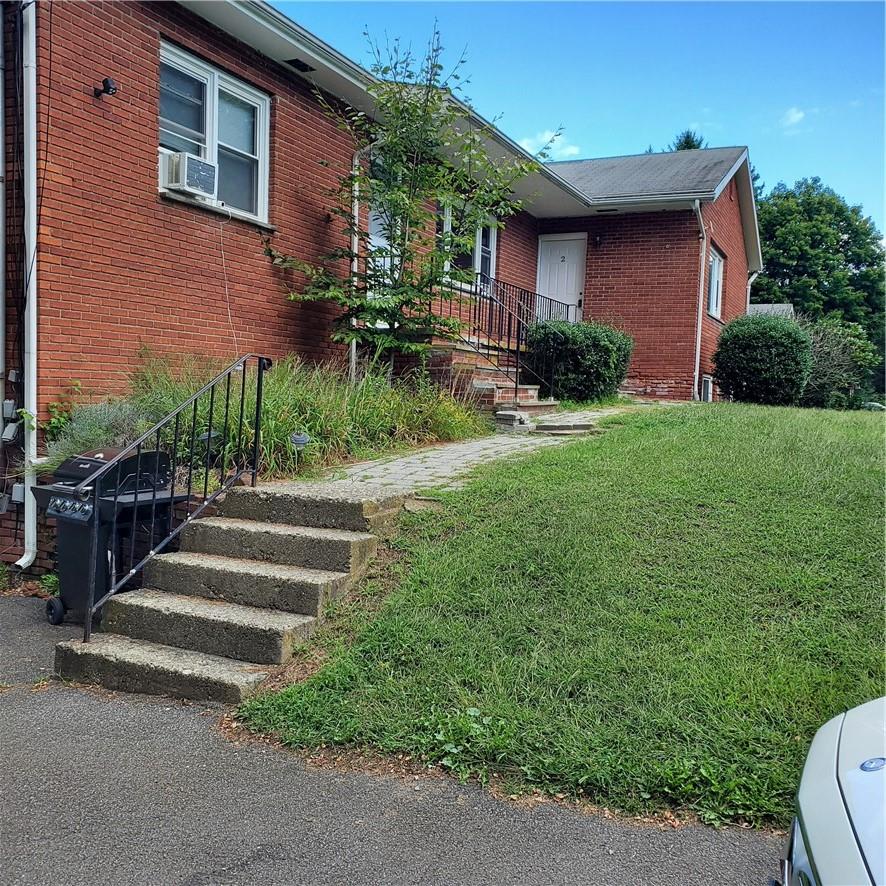 191 Plains Road, Unit 2 Walden, NY 12586 - Photo 1 of 1 a front view of a house with a yard