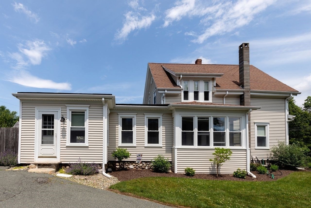 1012 Washington Street Whitman, MA 02382 - Photo 11 of 37 a front view of a house with a yard