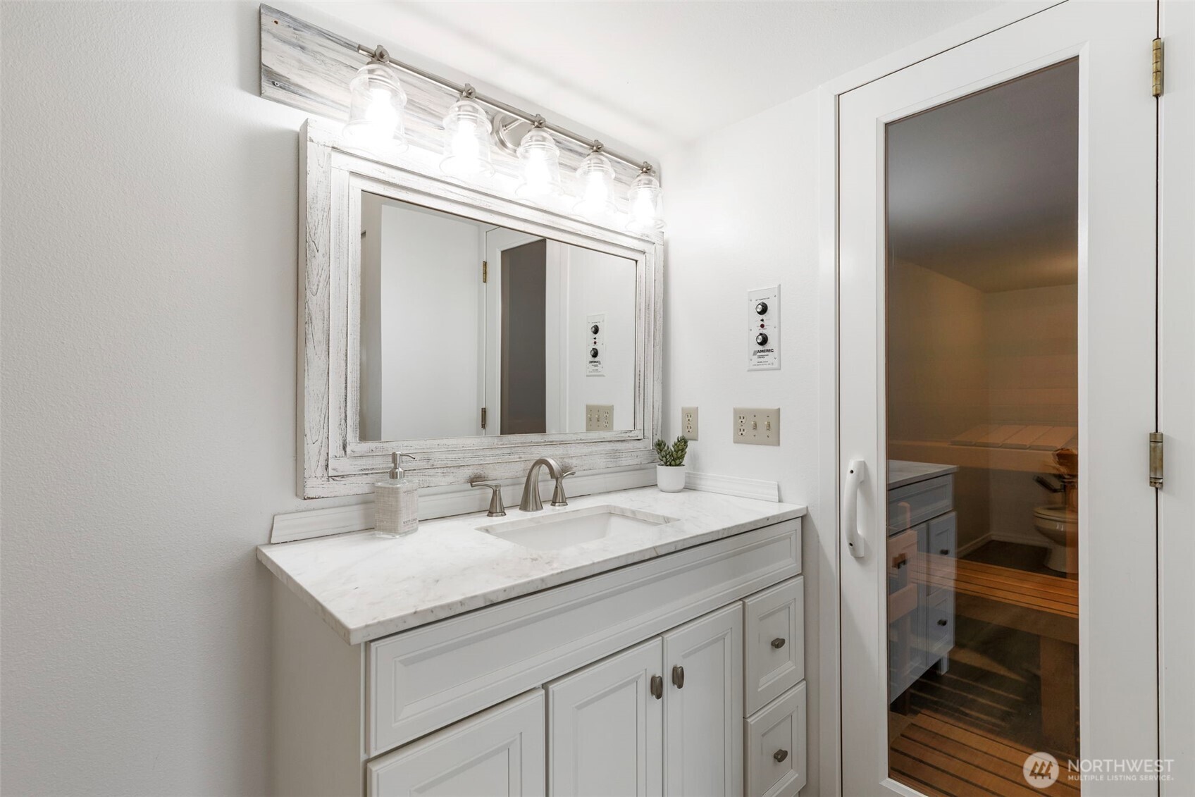 14110 Glenwood Road Southwest Port Orchard, WA 98367 - Photo 26 of 40 a bathroom with a sink and a mirror