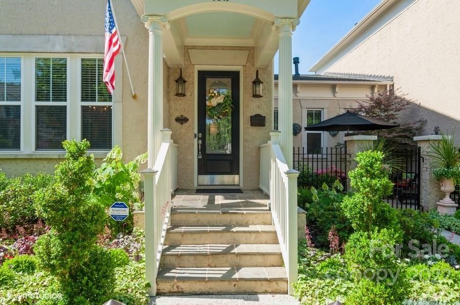 9517 Wheatfield Road Charlotte, NC 28277 - Photo 2 of 41 a front view of a house with plants