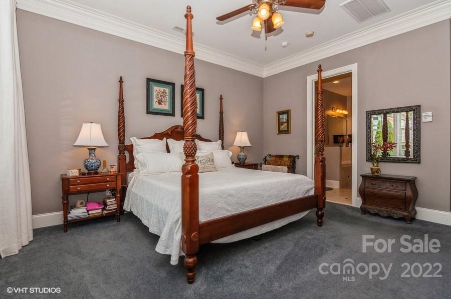 9517 Wheatfield Road Charlotte, NC 28277 - Photo 23 of 41 a bed room with a bed and a chair