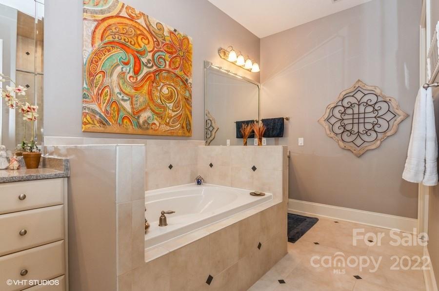 9517 Wheatfield Road Charlotte, NC 28277 - Photo 26 of 41 a bathroom with a bathtub and a sink