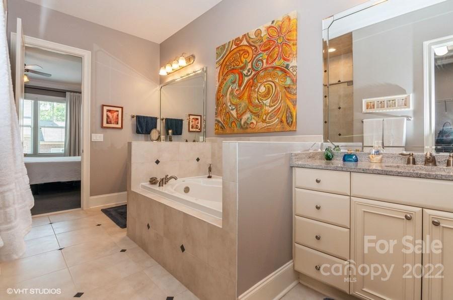 9517 Wheatfield Road Charlotte, NC 28277 - Photo 27 of 41 a bathroom with a sink a vanity and a mirror