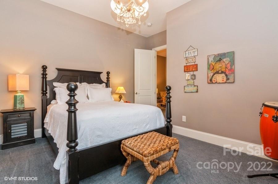 9517 Wheatfield Road Charlotte, NC 28277 - Photo 29 of 41 a bedroom with a bed and wooden floor