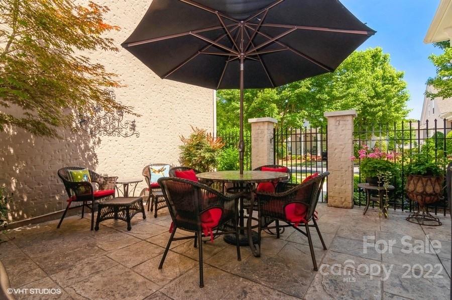 9517 Wheatfield Road Charlotte, NC 28277 - Photo 35 of 41 a patio with a patio table and chairs
