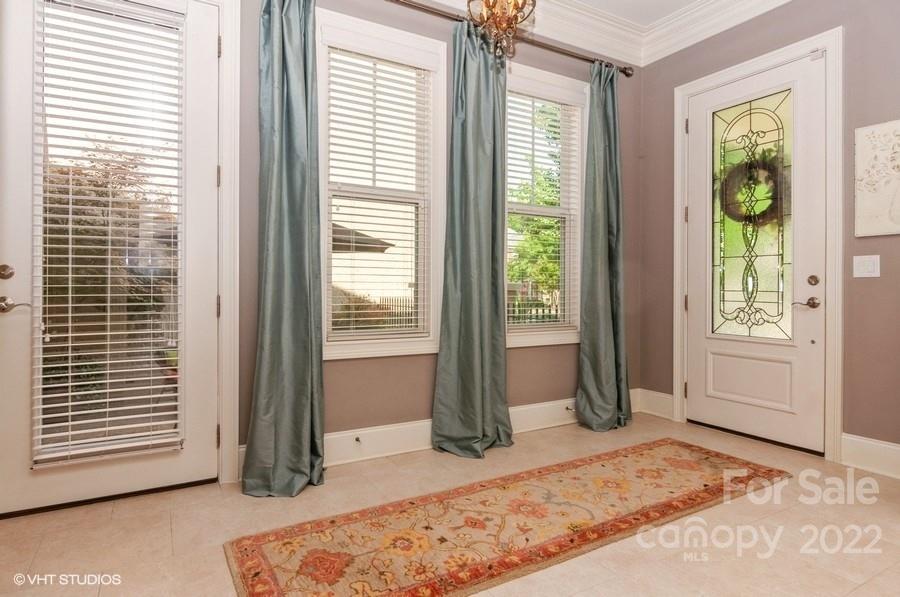 9517 Wheatfield Road Charlotte, NC 28277 - Photo 7 of 41 a view of a bedroom with a bed and balcony
