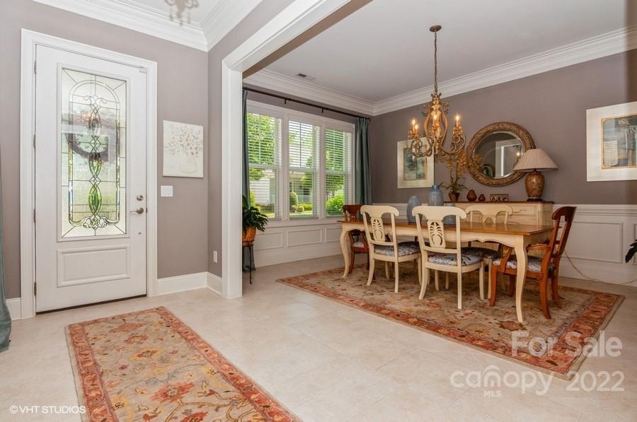 9517 Wheatfield Road Charlotte, NC 28277 - Photo 8 of 41 a view of a dining room and livingroom with furniture window and wooden floor