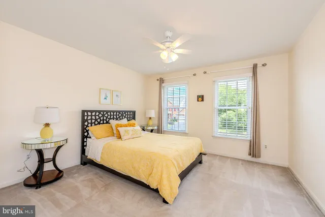 a bedroom with a bed and a table