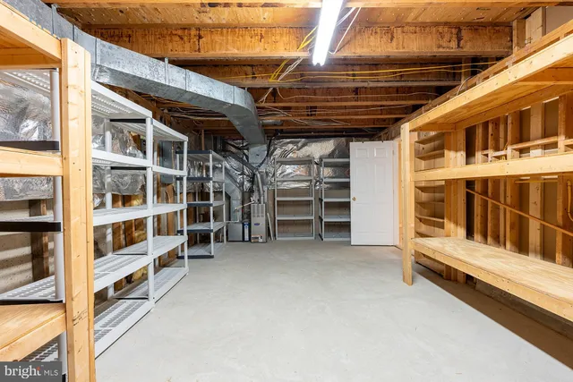 a view of an empty room with furniture