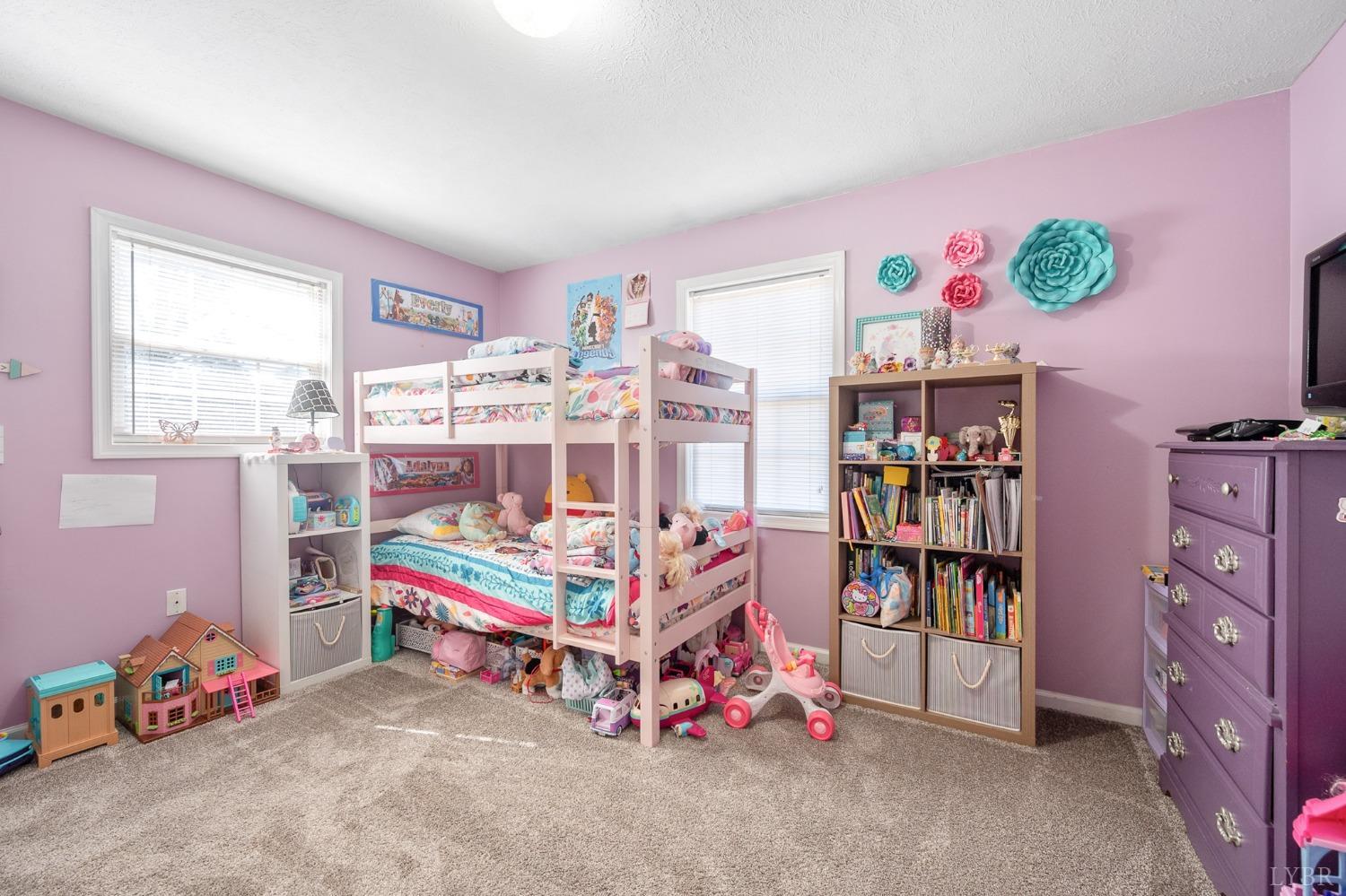 360 Webster Drive Concord, VA 24538 - Photo 19 of 36 a bedroom with a bed and a bookshelf