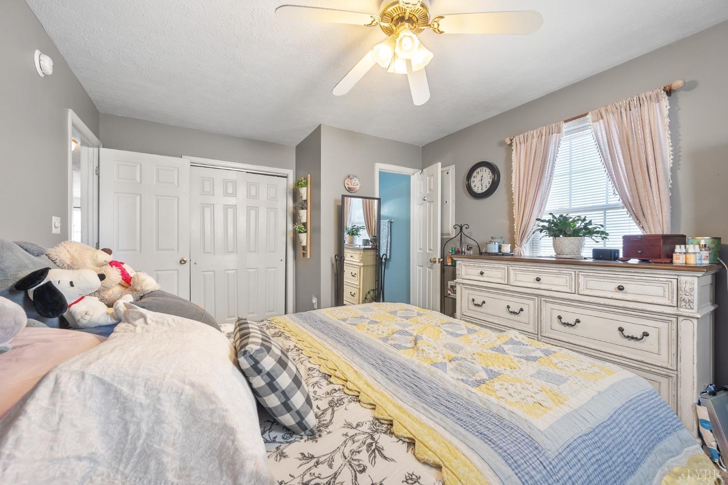 360 Webster Drive Concord, VA 24538 - Photo 23 of 36 a bedroom with a bed and a chandelier