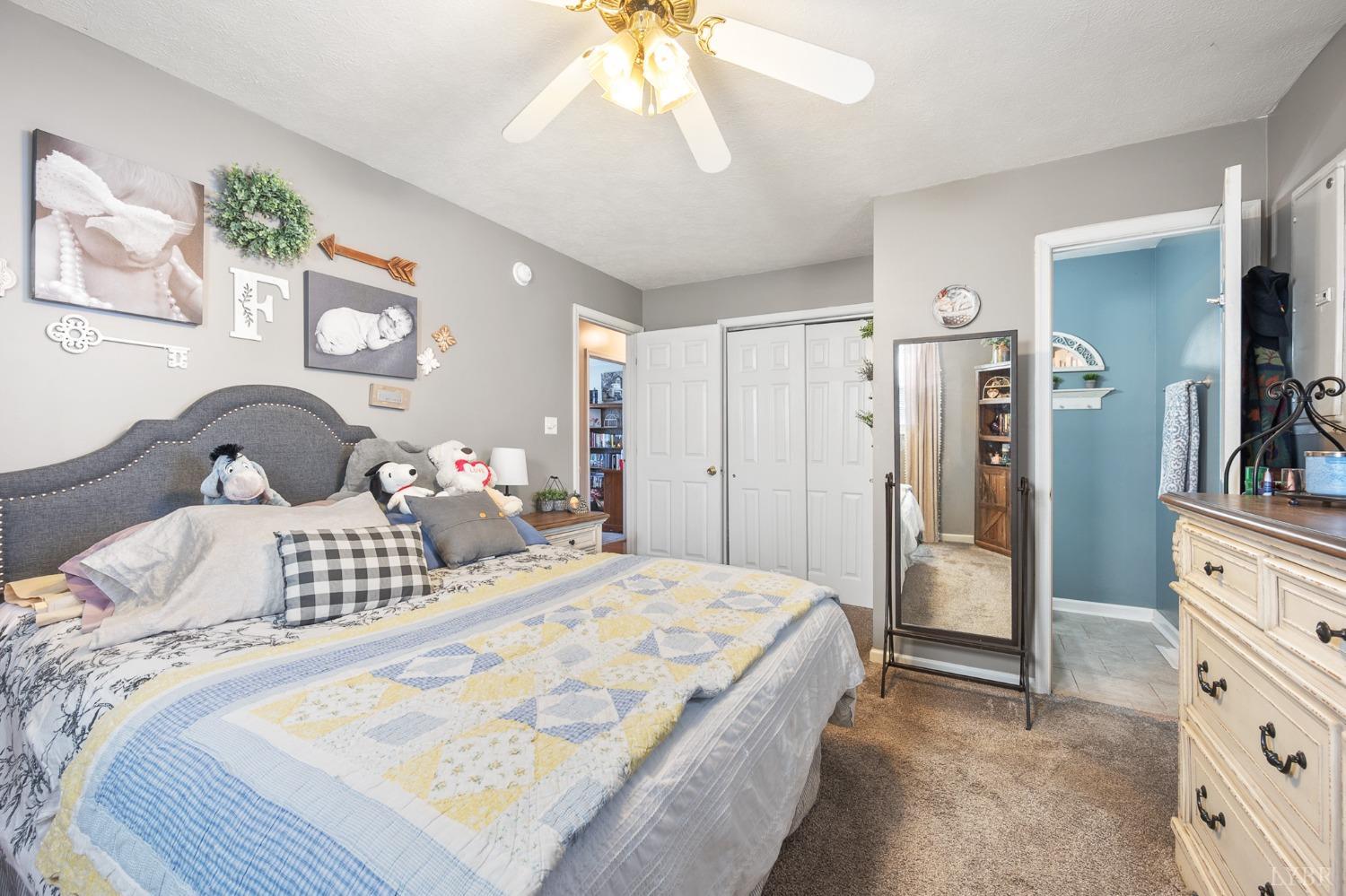 360 Webster Drive Concord, VA 24538 - Photo 24 of 36 a bedroom with a bed and a chandelier