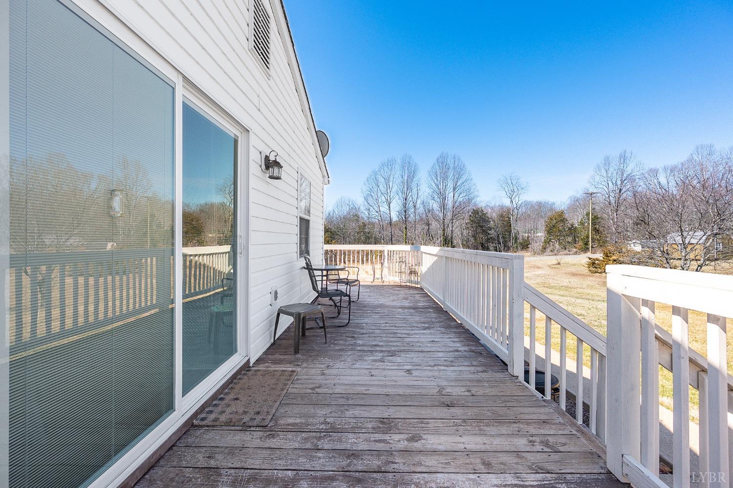 360 Webster Drive Concord, VA 24538 - Photo 28 of 36 a view of a balcony with wooden floor and fence