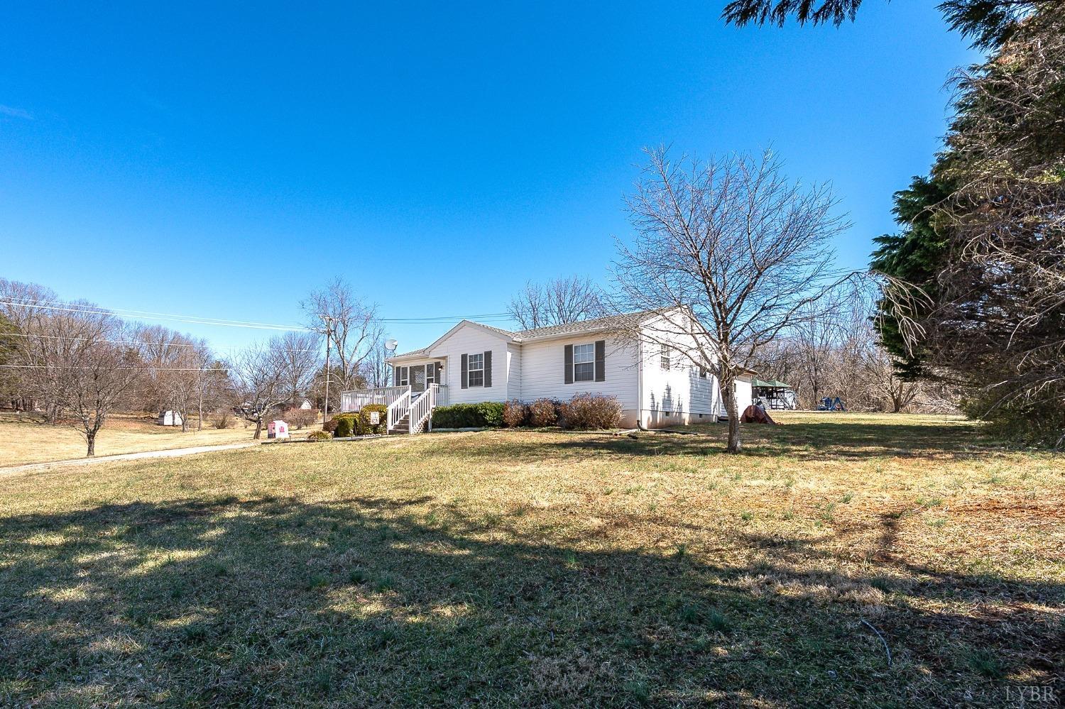 360 Webster Drive Concord, VA 24538 - Photo 35 of 36 a view of a yard with a house in the background
