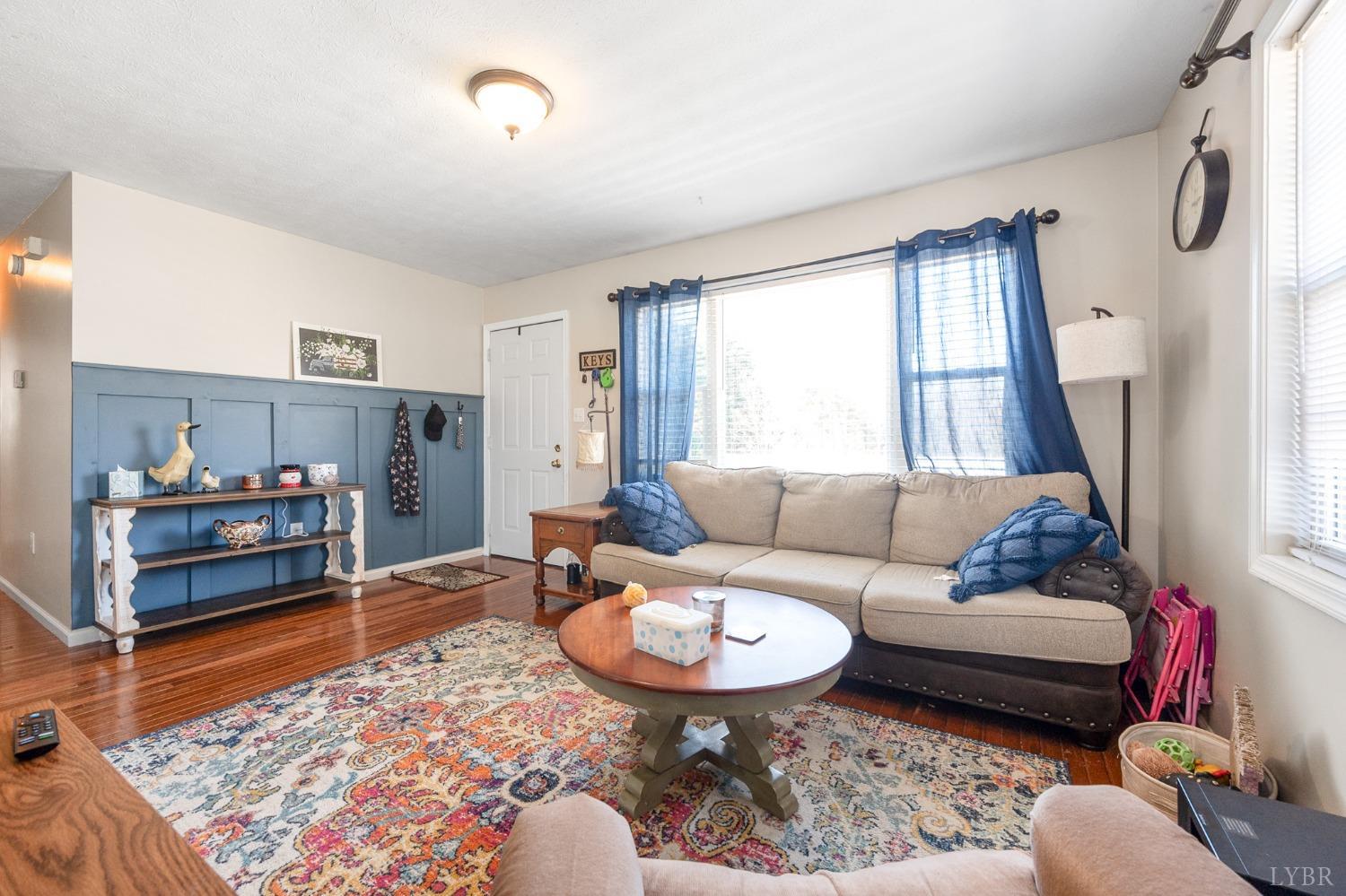 360 Webster Drive Concord, VA 24538 - Photo 8 of 36 a living room with furniture and a rug