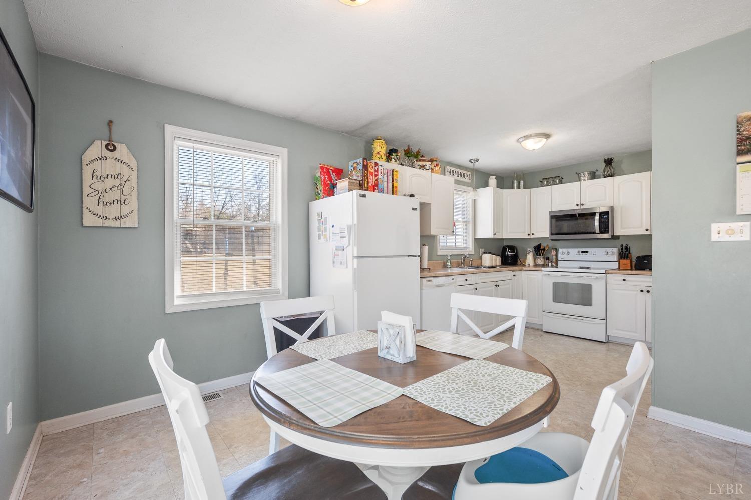 360 Webster Drive Concord, VA 24538 - Photo 10 of 36 a kitchen with white cabinets and stainless steel appliances