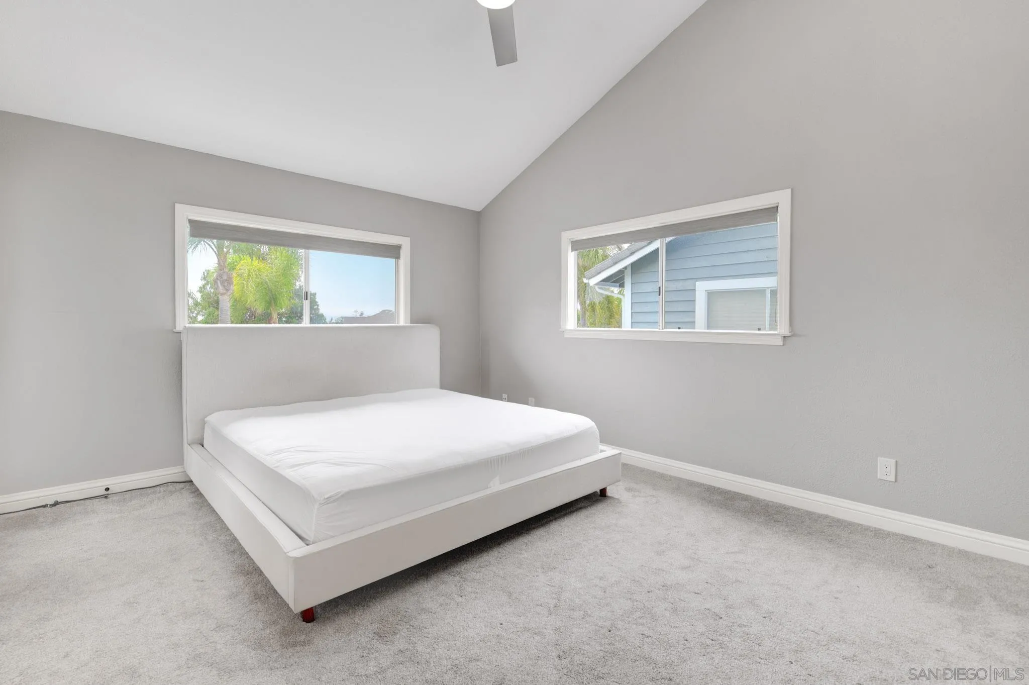 418 Summer View Circle Encinitas, CA 92024 - Photo 15 of 30 a white bed sitting in a bedroom next to a window