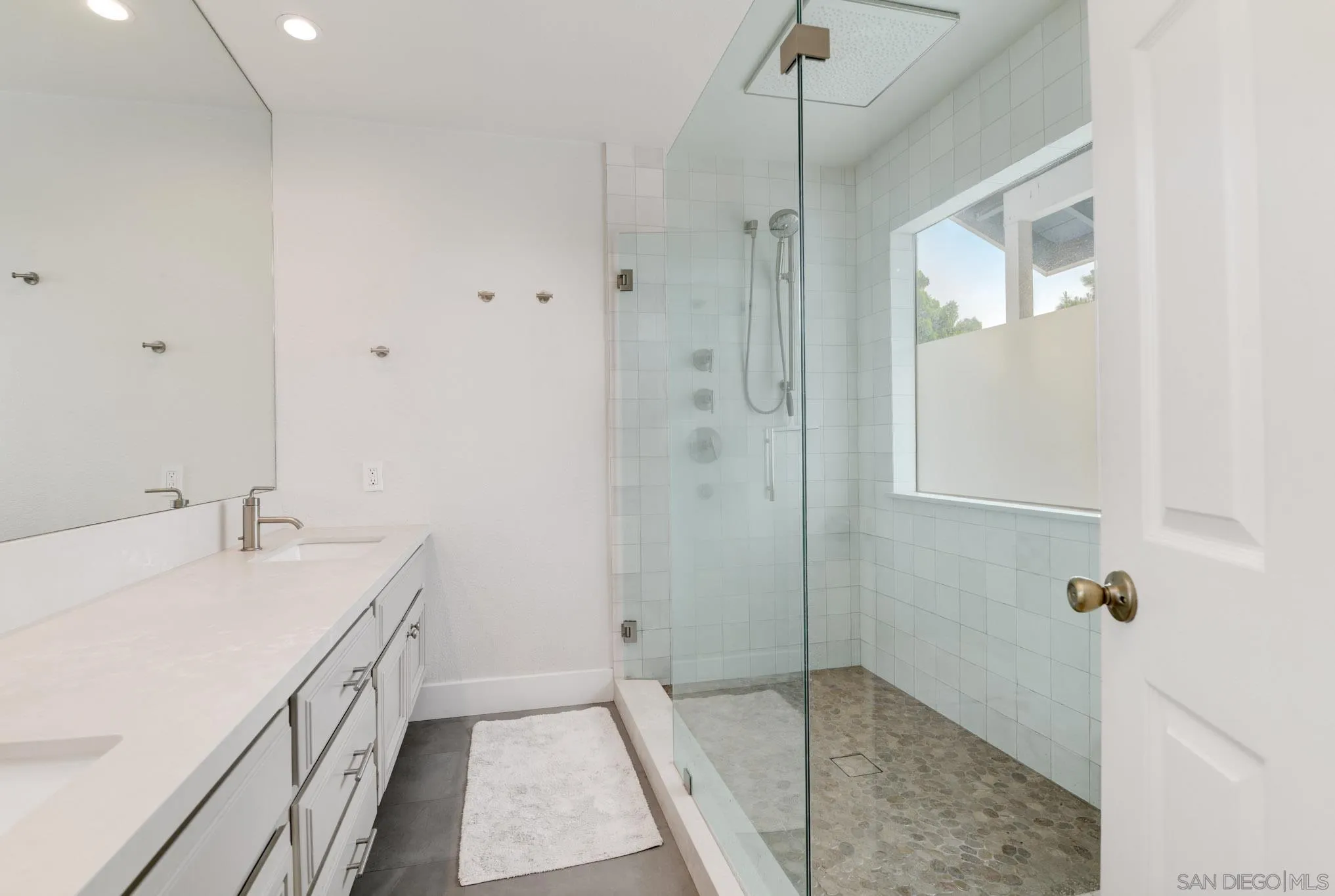 418 Summer View Circle Encinitas, CA 92024 - Photo 19 of 30 a bathroom with a granite countertop sink a mirror and shower