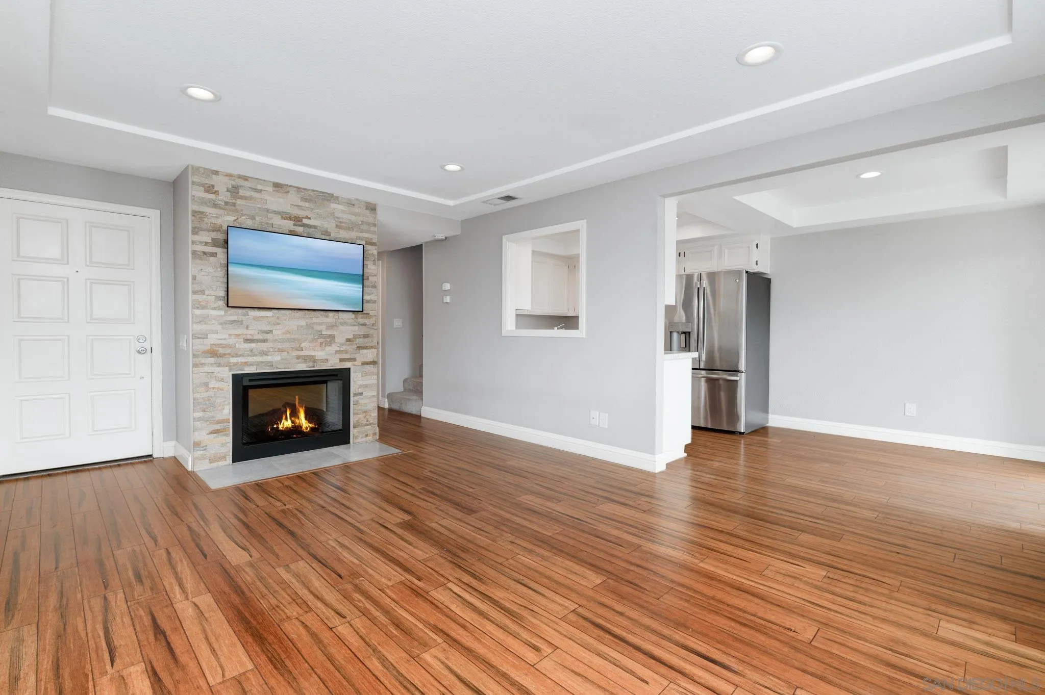 418 Summer View Circle Encinitas, CA 92024 - Photo 5 of 30 a view of an empty room with wooden floor fireplace and a window