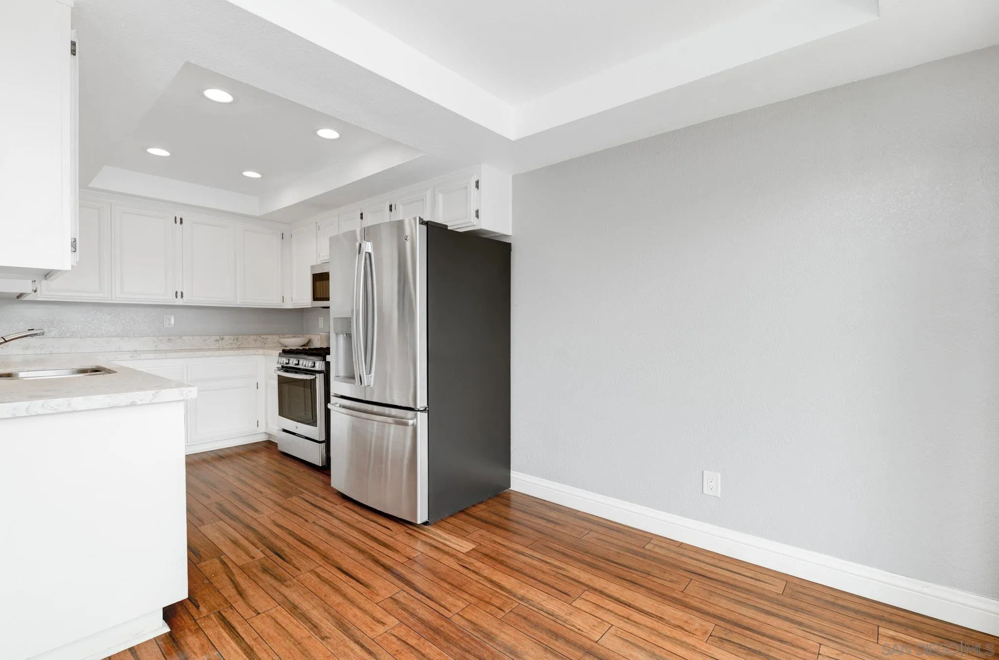 418 Summer View Circle Encinitas, CA 92024 - Photo 7 of 30 a kitchen with stainless steel appliances a refrigerator and a stove top oven