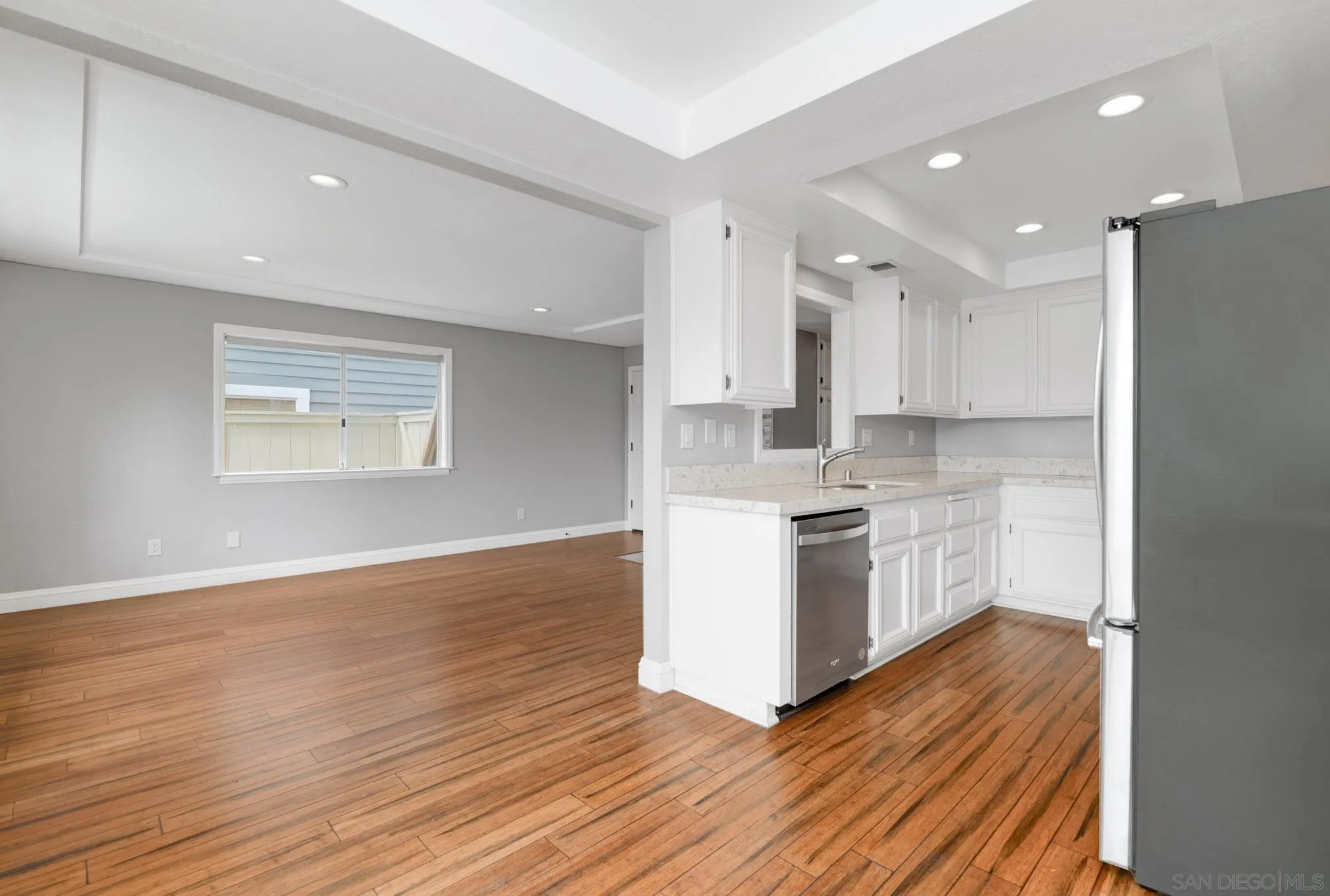 418 Summer View Circle Encinitas, CA 92024 - Photo 8 of 30 a kitchen with a refrigerator and a stove top oven