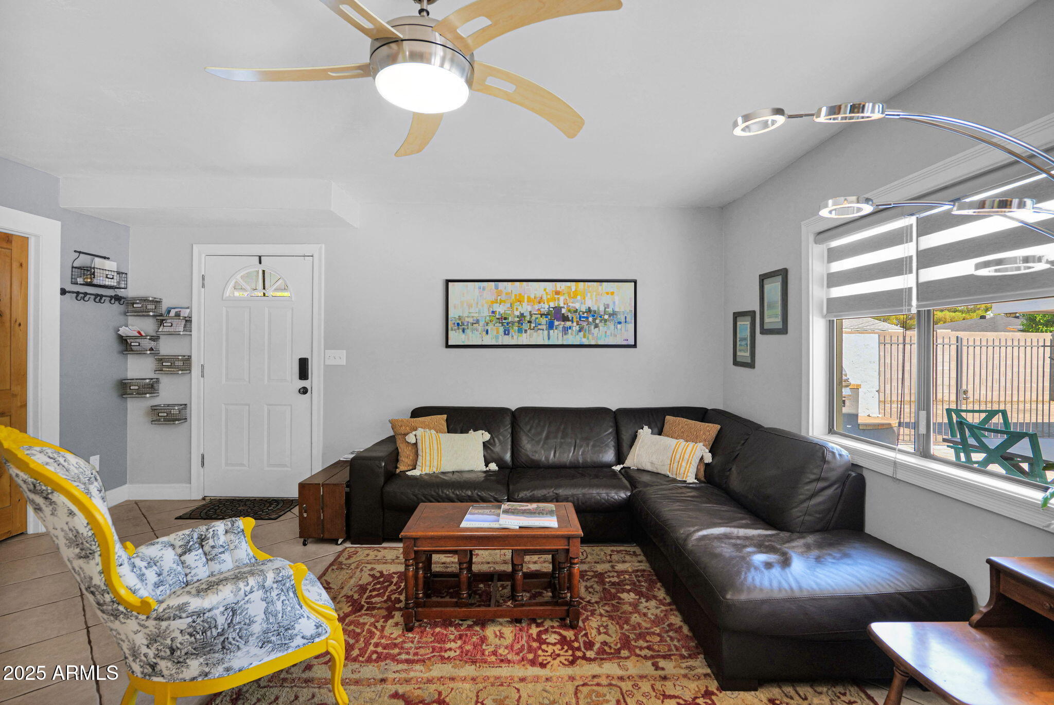 3217 East Flower Street Phoenix, AZ 85018 - Photo 12 of 60 a living room with furniture and a large window