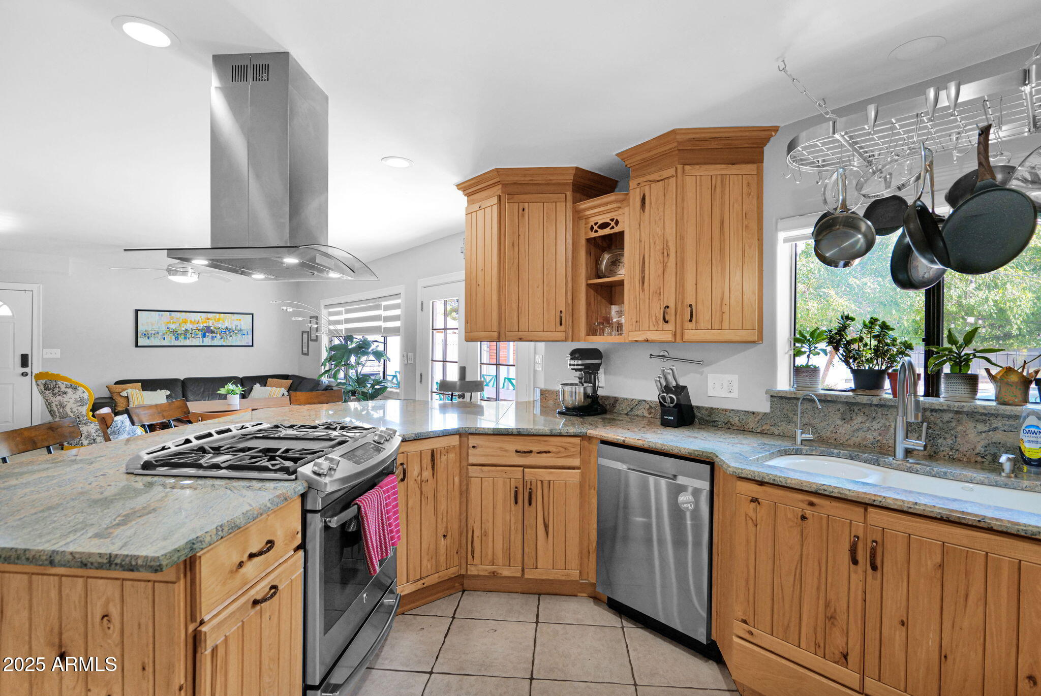 3217 East Flower Street Phoenix, AZ 85018 - Photo 17 of 60 a kitchen with stainless steel appliances granite countertop a sink stove and cabinets