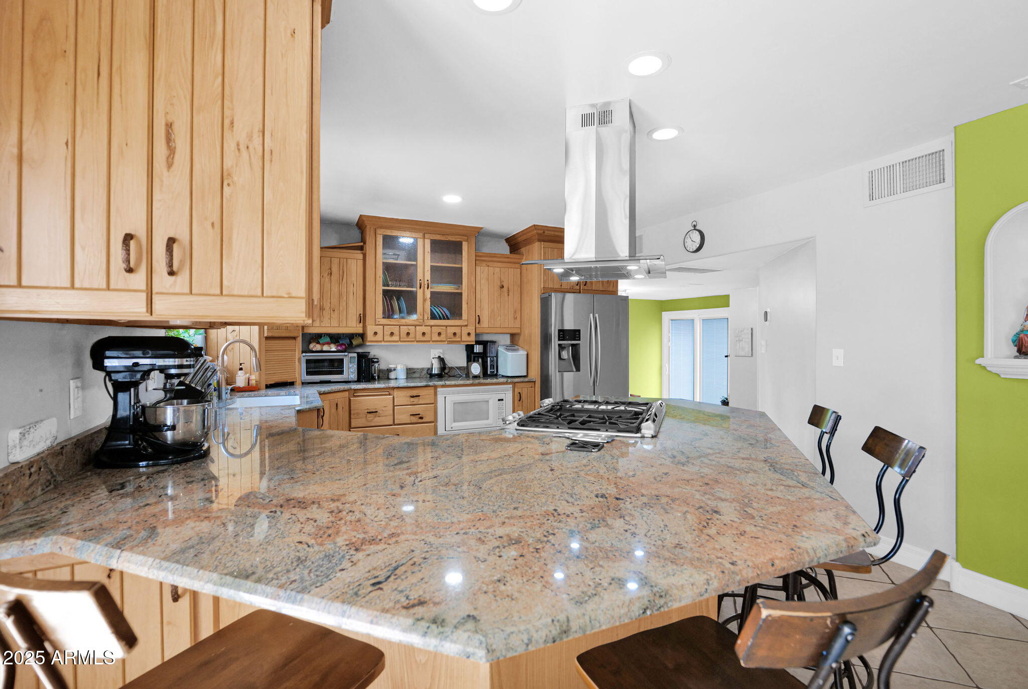 3217 East Flower Street Phoenix, AZ 85018 - Photo 19 of 60 a kitchen with stainless steel appliances granite countertop a sink and cabinets