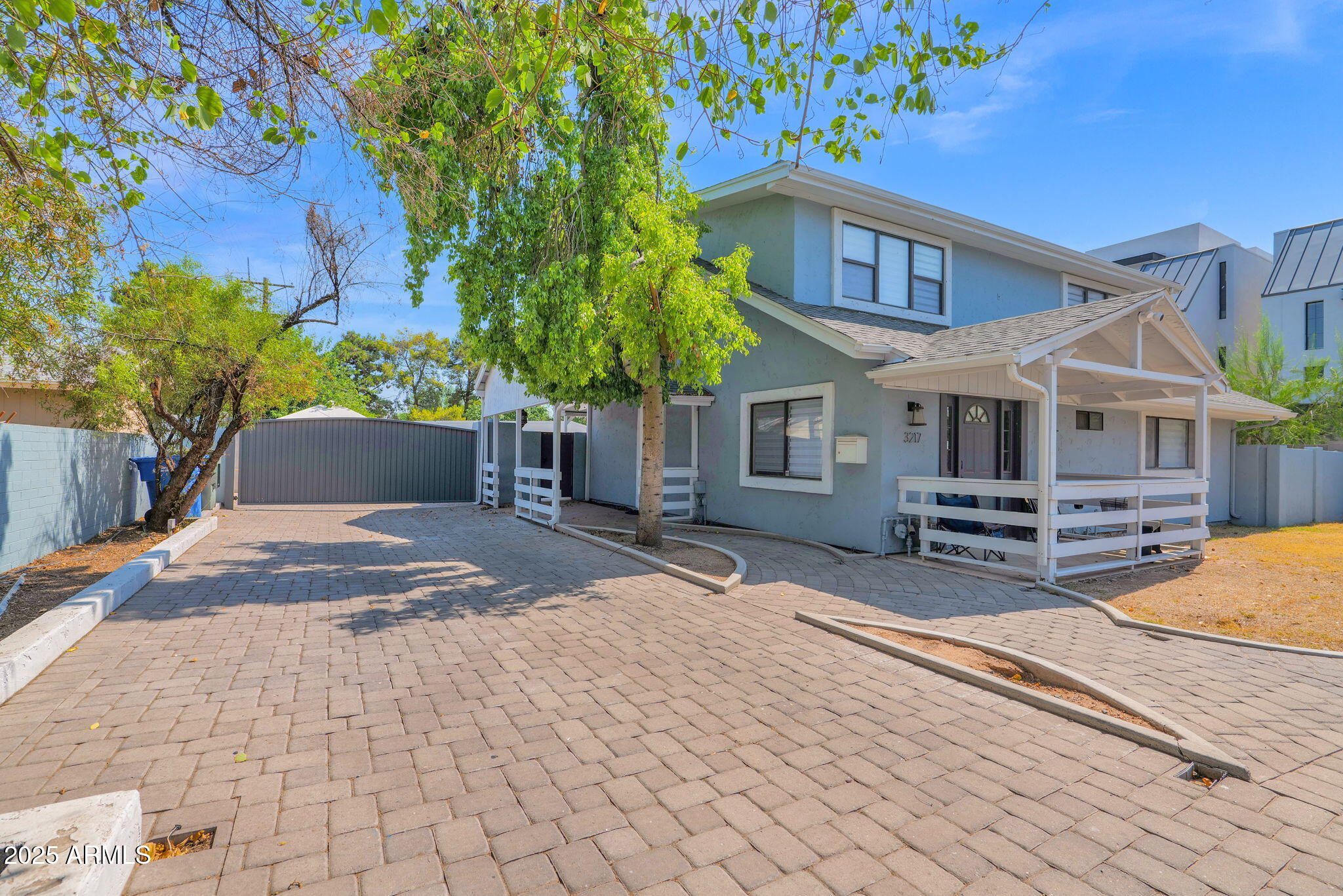 3217 East Flower Street Phoenix, AZ 85018 - Photo 2 of 60 a view of a house with backyard and sitting area