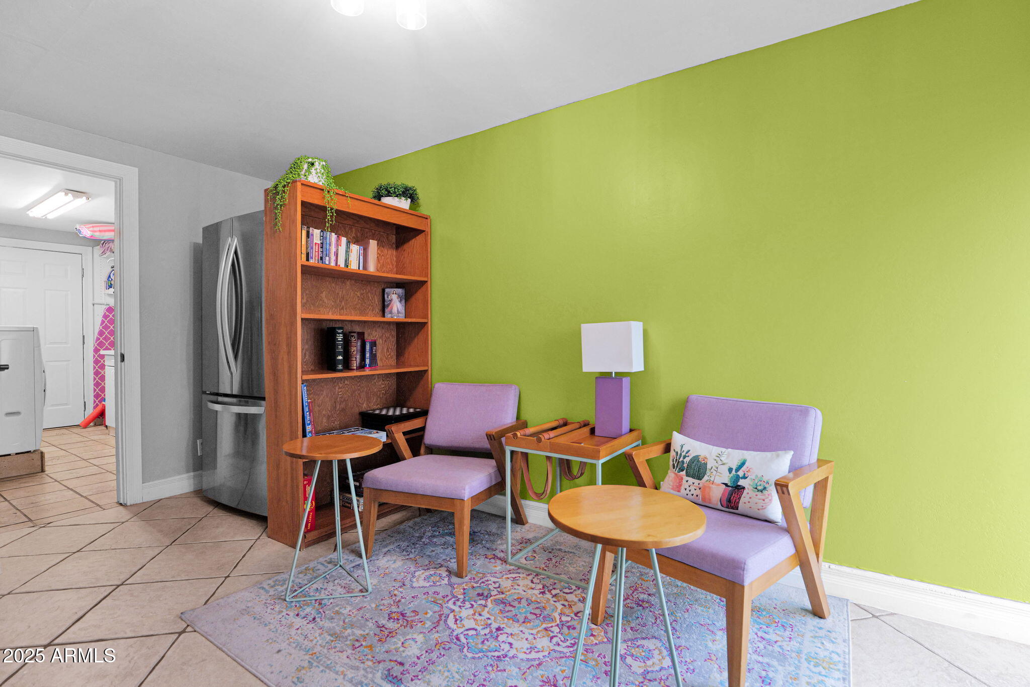 3217 East Flower Street Phoenix, AZ 85018 - Photo 23 of 60 a room with furniture and a book shelf