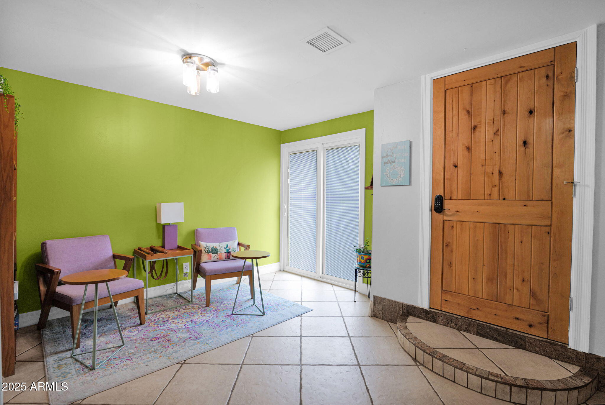 3217 East Flower Street Phoenix, AZ 85018 - Photo 24 of 60 a view of a bedroom with furniture and a window