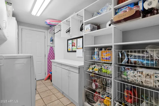 a view of a chairs and tables in the backyard of the house