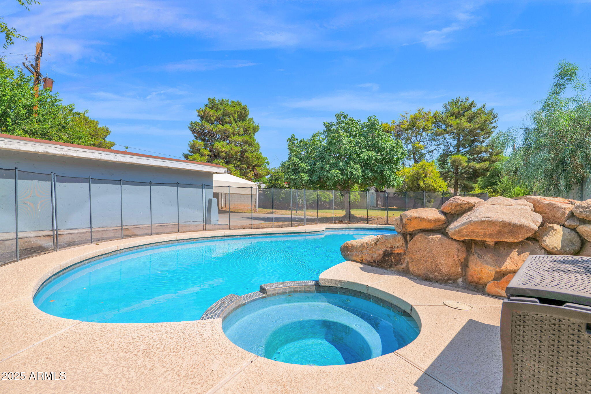 3217 East Flower Street Phoenix, AZ 85018 - Photo 26 of 60 a view of a swimming pool with a patio