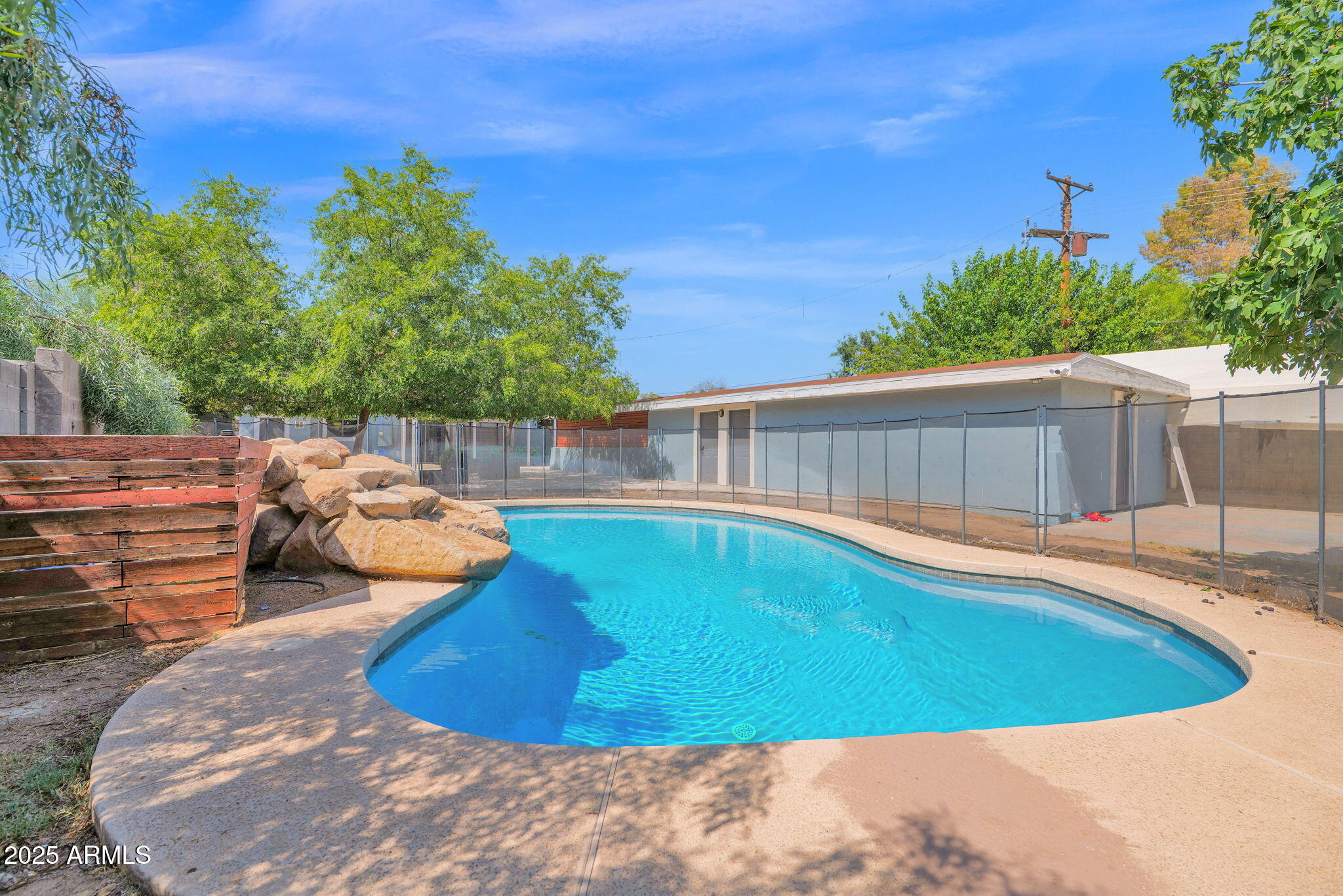 3217 East Flower Street Phoenix, AZ 85018 - Photo 27 of 60 a view of a swimming pool with a patio