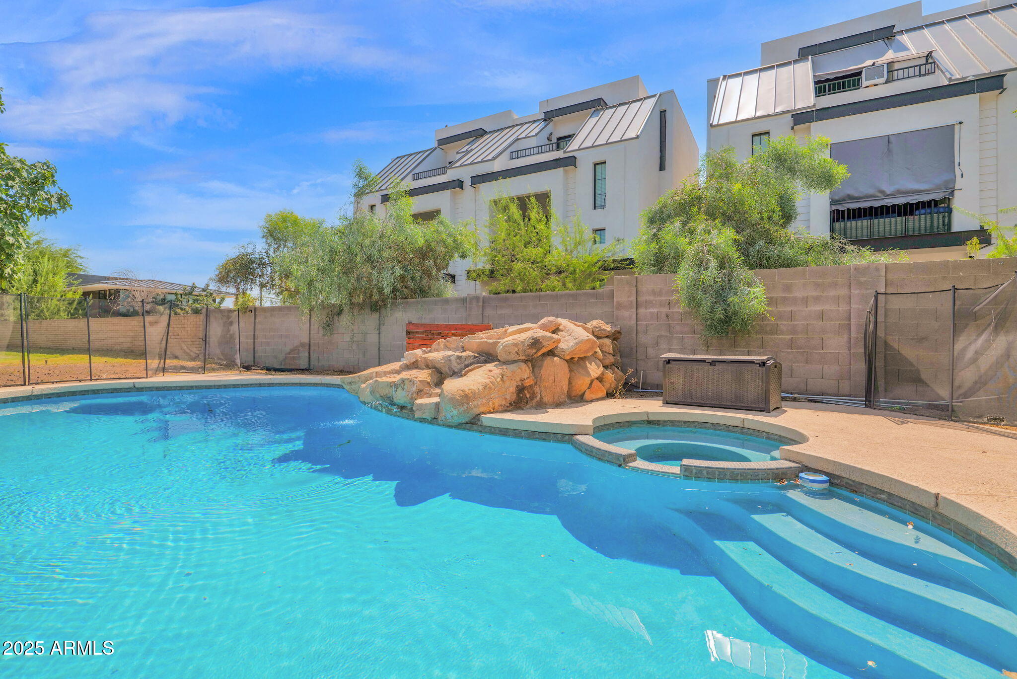 3217 East Flower Street Phoenix, AZ 85018 - Photo 28 of 60 a backyard of a house with wooden floor