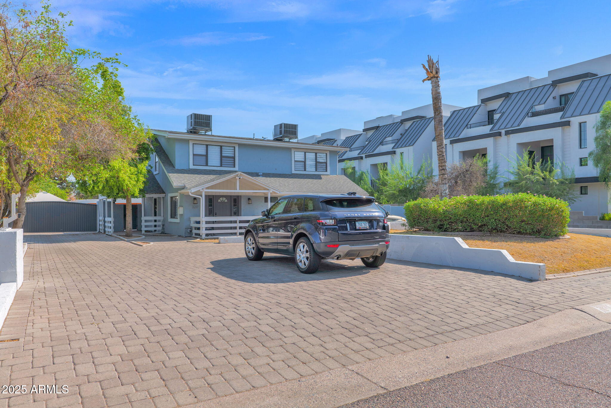 3217 East Flower Street Phoenix, AZ 85018 - Photo 3 of 60 a view of a building with sitting area and garden