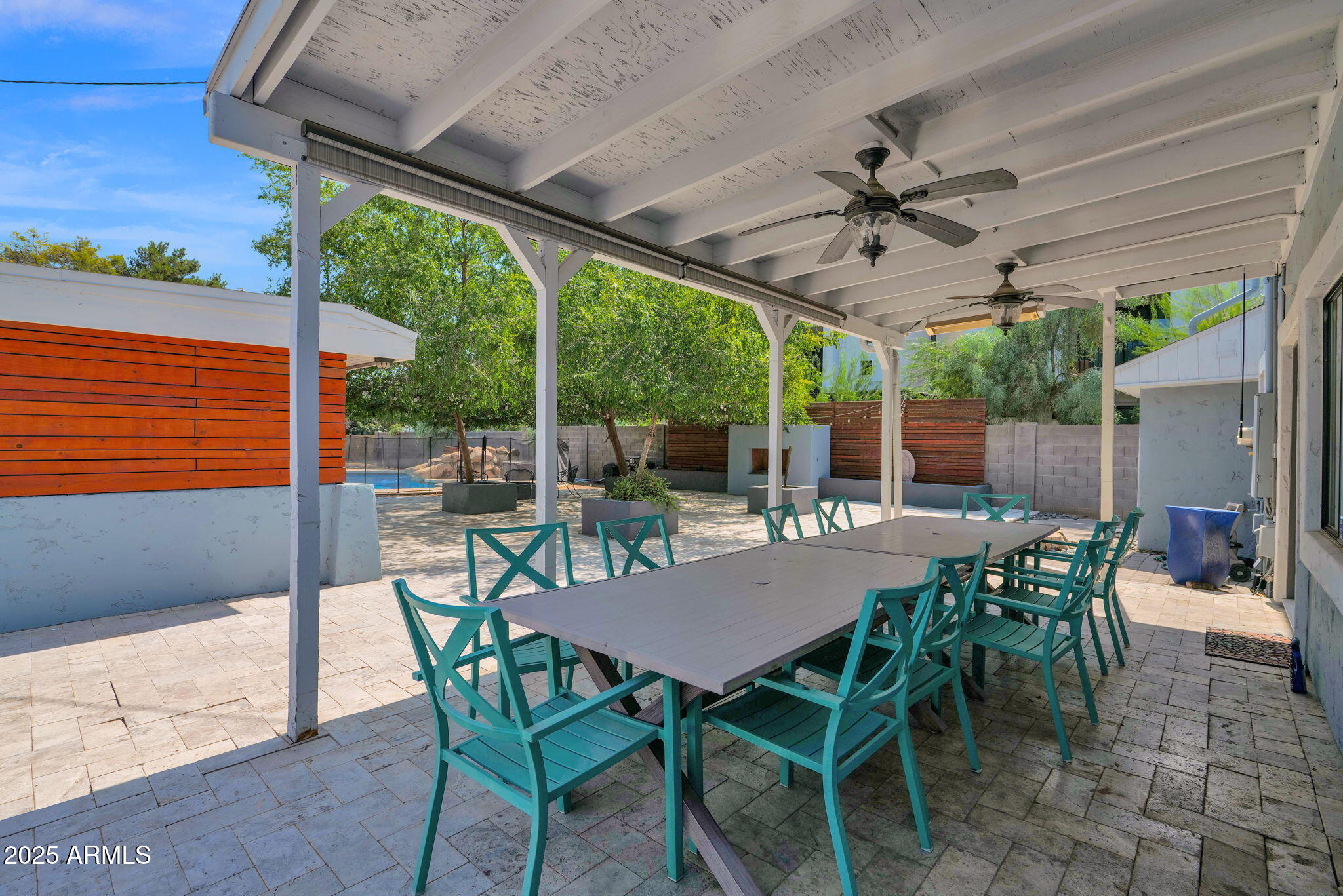 3217 East Flower Street Phoenix, AZ 85018 - Photo 33 of 60 a view of a patio with a table and chairs