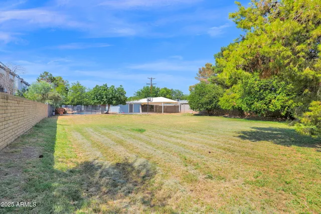 a very nice looking house with a large parking space