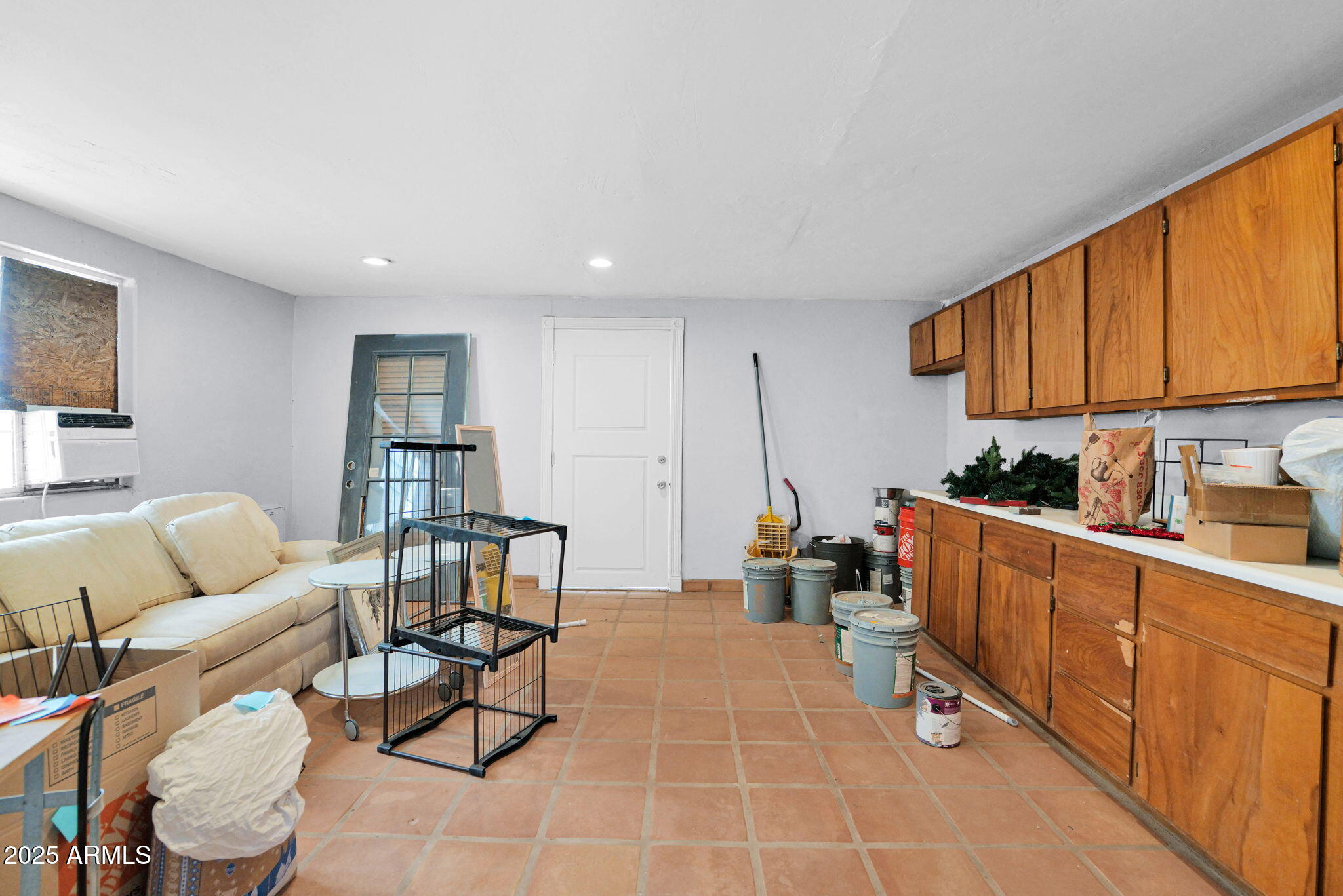 3217 East Flower Street Phoenix, AZ 85018 - Photo 44 of 60 a living room with furniture a rug and a window