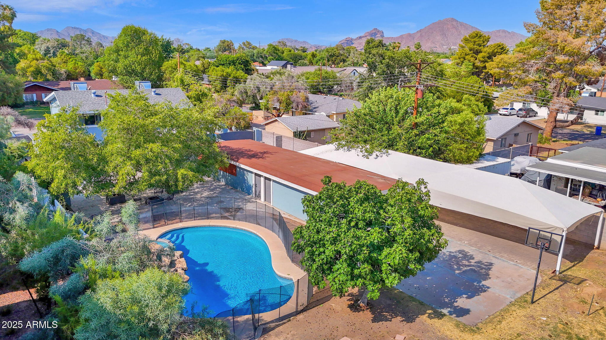 3217 East Flower Street Phoenix, AZ 85018 - Photo 49 of 60 an aerial view of a house with a yard and lake view