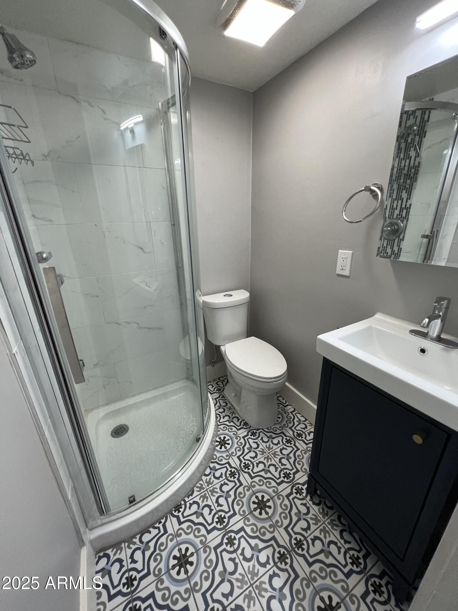 3217 East Flower Street Phoenix, AZ 85018 - Photo 54 of 60 a bathroom with a sink toilet and shower