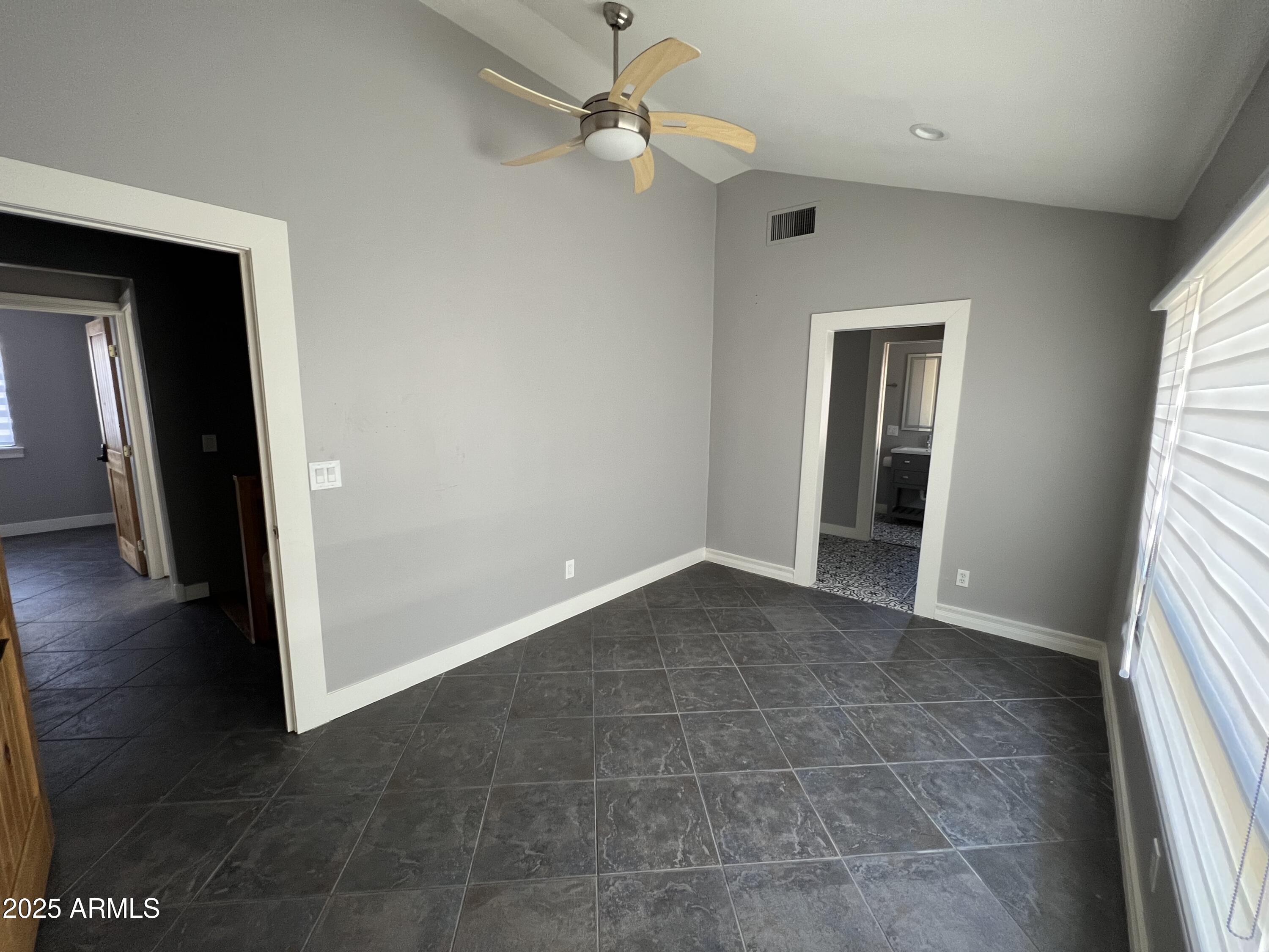 3217 East Flower Street Phoenix, AZ 85018 - Photo 57 of 60 wooden floor in an empty room with a window